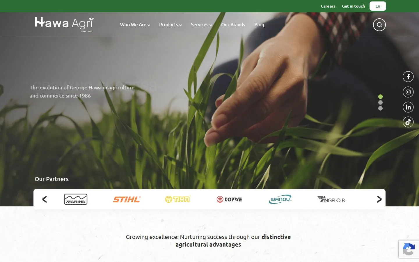 Hawa Agri homepage on desktop, with a full-width photo of a hand touching young crops, the main navigation, and a carousel of partner brand logos